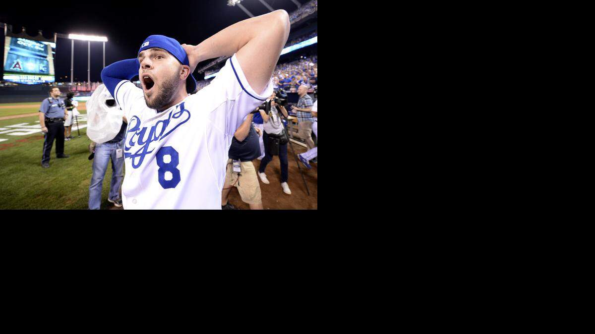 
Kansas City Royals third baseman Mike Moustakas (8) has a look of astonishment as the celebration continues during the Kansas City Royals and Oakland Athletics baseball game at Kauffman Stadium on Tuesday, September 30, 2014, in Kansas City, Missouri. Royals won 9-8.

