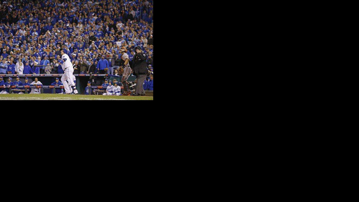 
Kansas City Royals' Billy Butler watches his sacrifice fly in the sixth inning of Game 3 of the American League Championship Series against the Baltimore Orioles Tuesday in Kansas City. Jarrod Dyson scored on the play. 
