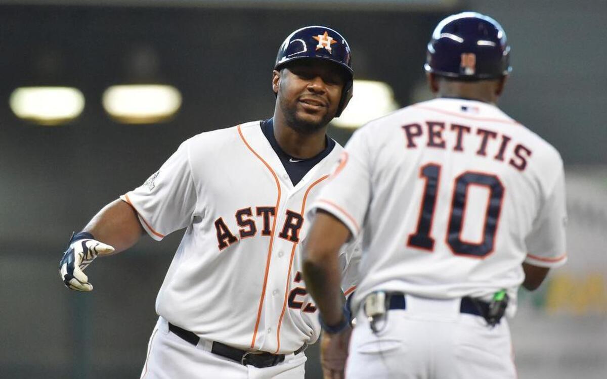 
Houston Astros first baseman Chris Carter was greeted by third base coach Gary Pettis as Carter rounded the bases after hitting a solo home run in the seventh inning during Sunday’s game at Minute Maid Park in Houston.
