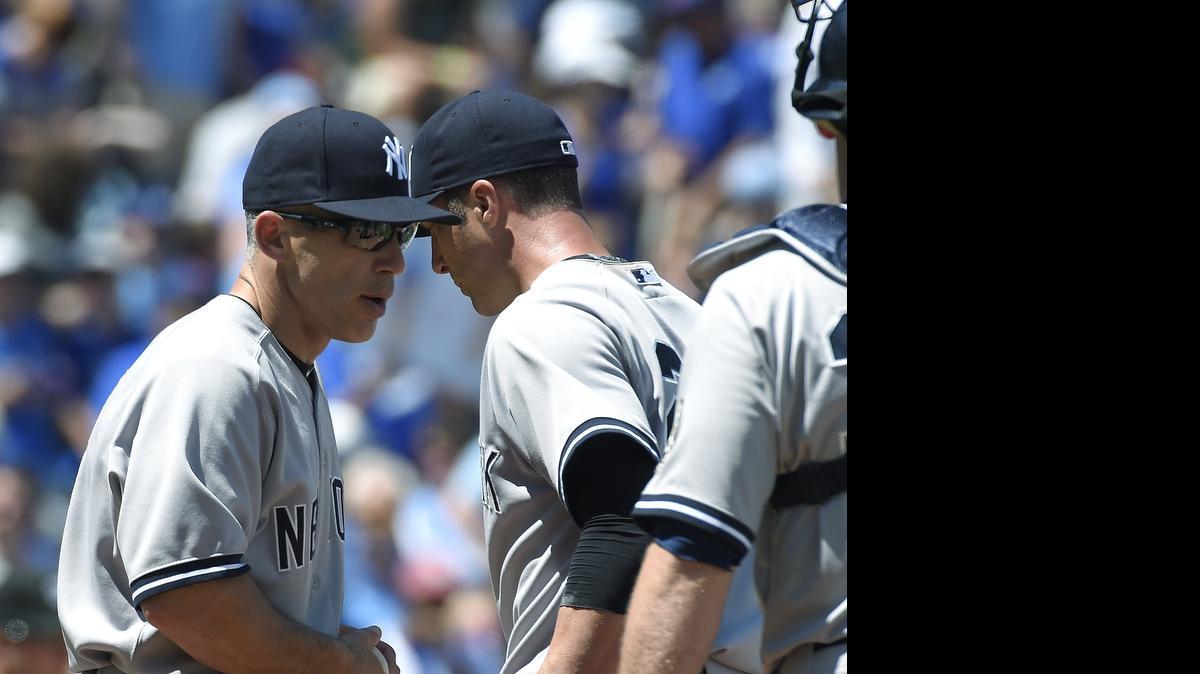 
Yankees manager Joe Girardi (left) reminisced about a trip to the Negro Leagues Baseball Museum before Sunday’s game.
