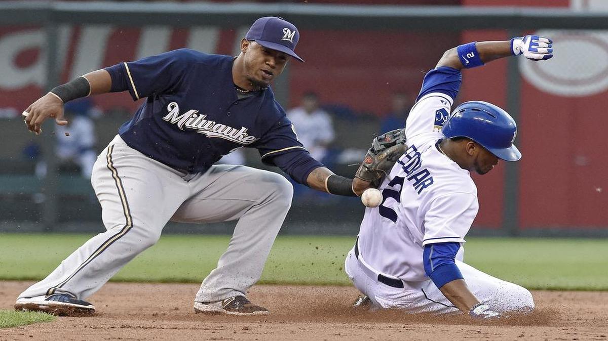 
Kansas City Royals shortstop Alcides Escobar stole second base as the throw to Milwaukee Brewers shortstop Jean Segura bounced away in the second inning during Thursday’s game.
