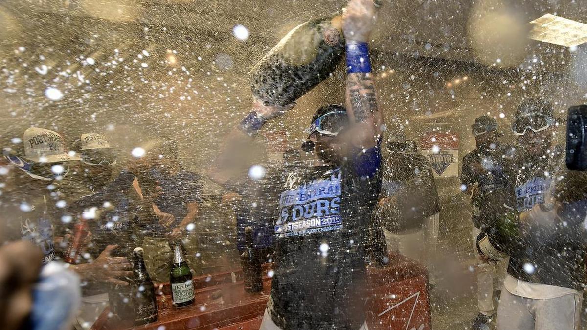
Kansas City Royals' Jonny Gomes lets loose with the champagne in the locker room following Thursday's baseball game against the Seattle Mariners to win the American League Central pennant on September 24, 2015 at Kauffman Stadium in Kansas City, Mo.
