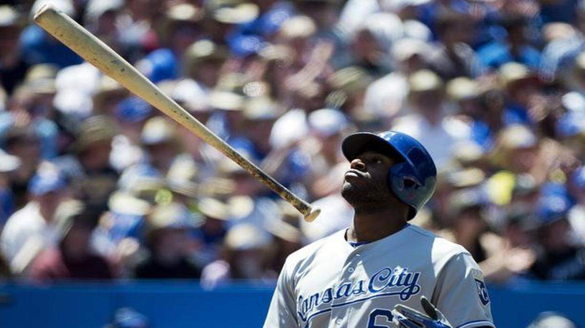 
The Royals' Lorenzo Cain tosses his bat in the air after striking out against the Blue Jays during Sunday’s baseball game in Toronto.
