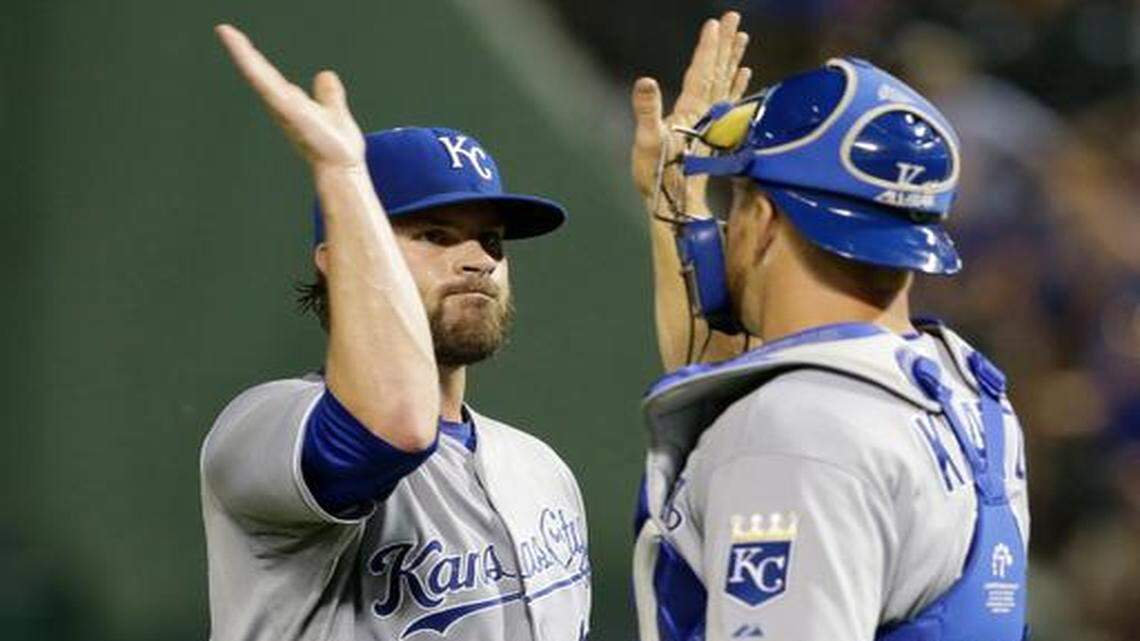 
Royals reliever Aaron Crow (43) and catcher Erik Kratz celebrated the final out of Saturday night’s 6-3 Royals win against the Texas Rangers. Manager Ned Yost is counting on better performances in middle relief from Crow and Jason Frasor as the regular season nears its end.

