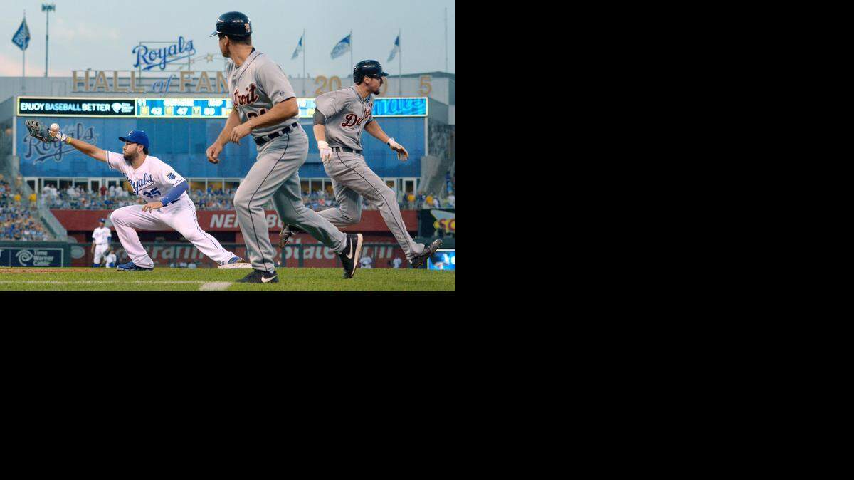 
Kansas City Royals first baseman Eric Hosmer (35) couldn't make the stop on a throw from third baseman Danny Valencia as Detroit Tigers' Nick Castellanos (9) reached on a single in the fifth inning during Thursday's baseball game on July 10, 2014 at Kauffman Stadium in Kansas City, Mo.
