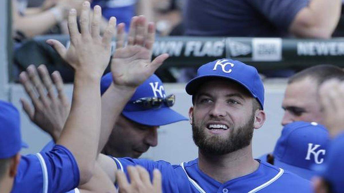 
Royals starting pticher Danny Duffy smiles as he celebrates with teammates in the dugout after being taken out of Saturday’s game by manager Ned Yost during the eighth inning in Chicago.
