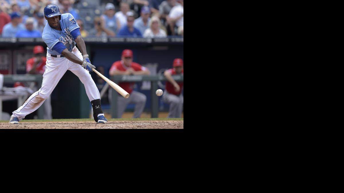 
Kansas City Royals' Lorenzo Cain (6) connects on a double in the sixth inning during Sunday's baseball game against the Los Angeles Angels on June 29, 2014 at Kauffman Stadium in Kansas City, Mo.
