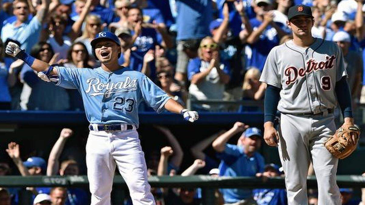 
The Royals’ Nori Aoki celebrated on third base after hitting a two-run triple in the fourth inning to score Mike Moustakas and Omar Infante against the Detroit Tigers on Sunday at Kauffman Stadium.
