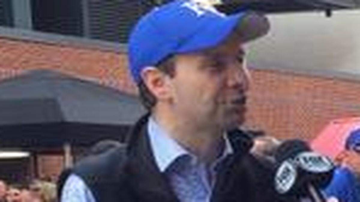 
White House Press Secretary Josh Earnest, left, was among those clad in blue on Saturday in Baltimore
