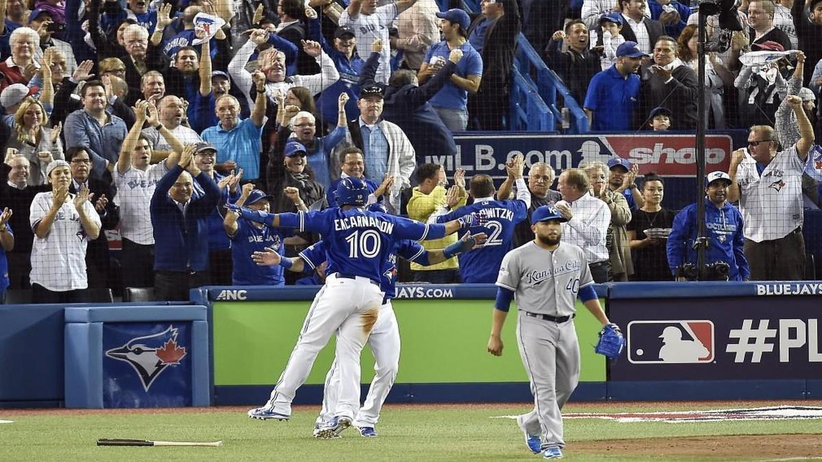 Toronto Blue Jays designated hitter Edwin Encarnacion celebrated scoring with right fielder Jose Bautista after Troy Tulowitzki drove three runs in on a bases-loaded double off Kansas City Royals relief pitcher Kelvin Herrera in the sixth inning of Game 5 of the ALCS Wednesday at Rogers Centre in Toronto.