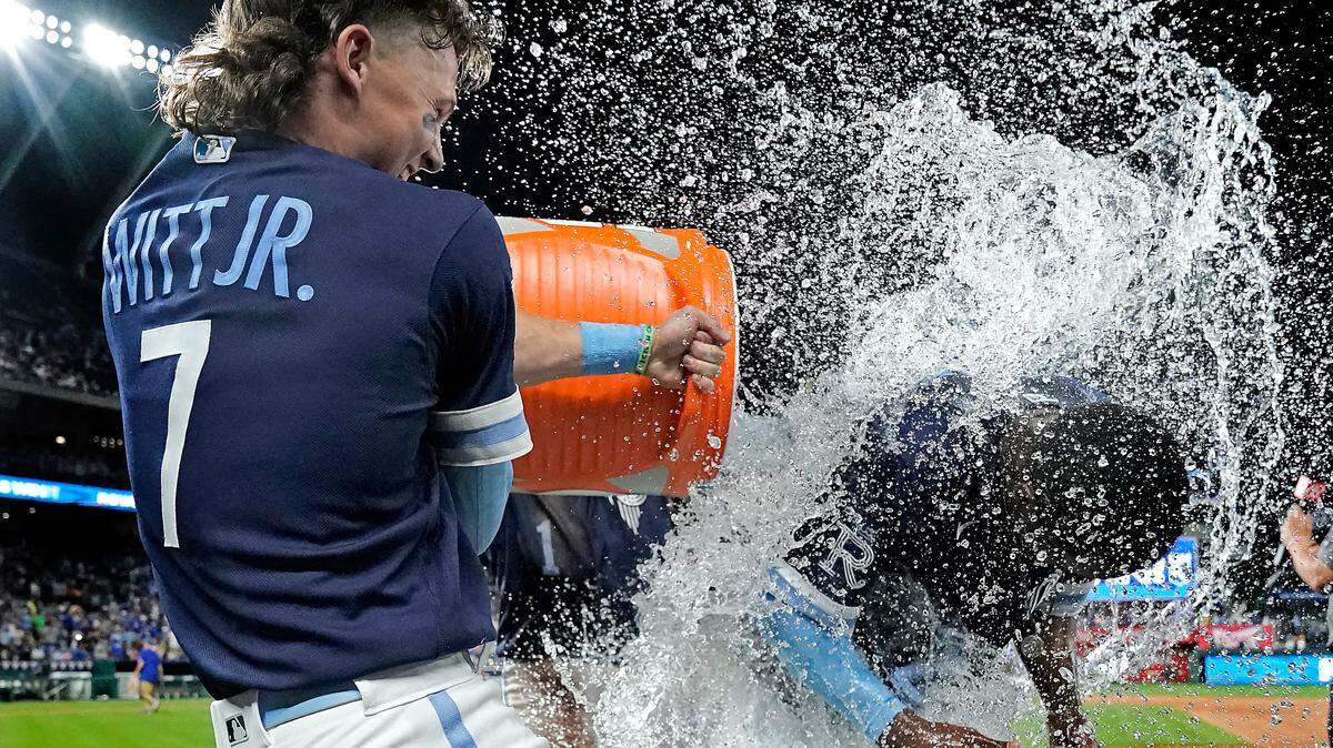 Kansas City Royals’ Michael A. Taylor is doused by Bobby Witt Jr. (7) and MJ Melendez after their baseball game against the Cleveland Guardians Friday, July 8, 2022, in Kansas City, Mo. The Royals won 4-3.