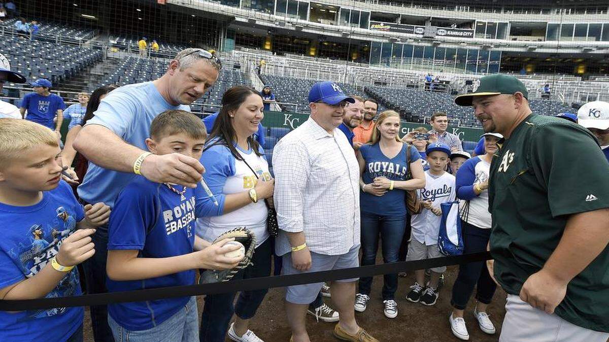 
Oakland Athletics designated hitter Billy Butler signed autographs before Friday’s baseball game against his former team, the Royals, at Kauffman Stadium in Kansas City, Mo.
