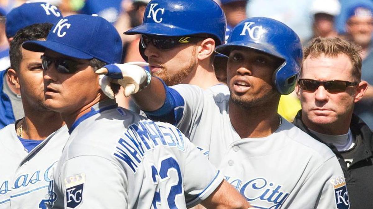 
Royals bench coach Don Wakamatsu (22) held back Alcides Escobar as Escobar gestured at Blue Jays pitcher Aaron Sanchez, who was ejected for hitting Escobar on Sunday in Toronto. The Blue Jays won the game 5-2.
