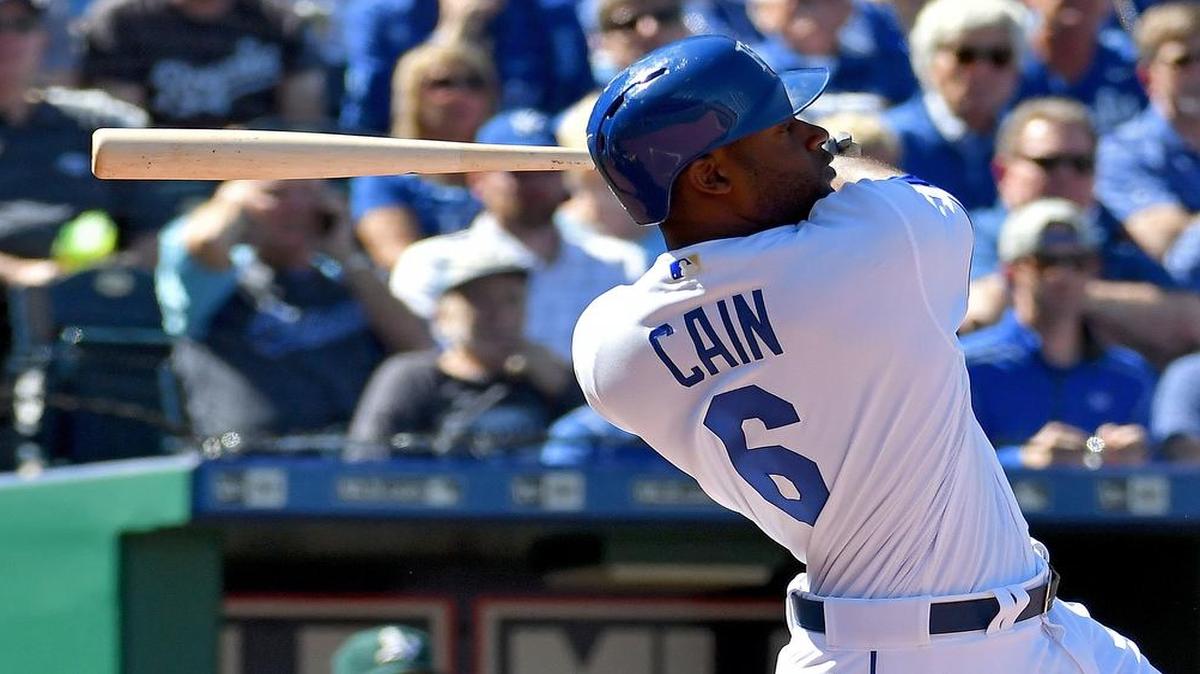 Kansas City Royals outfielder Lorenzo Cain follows through on a single in the first inning of Monday's baseball game against the Oakland Athletics at Kauffman Stadium in Kansas City, Mo.