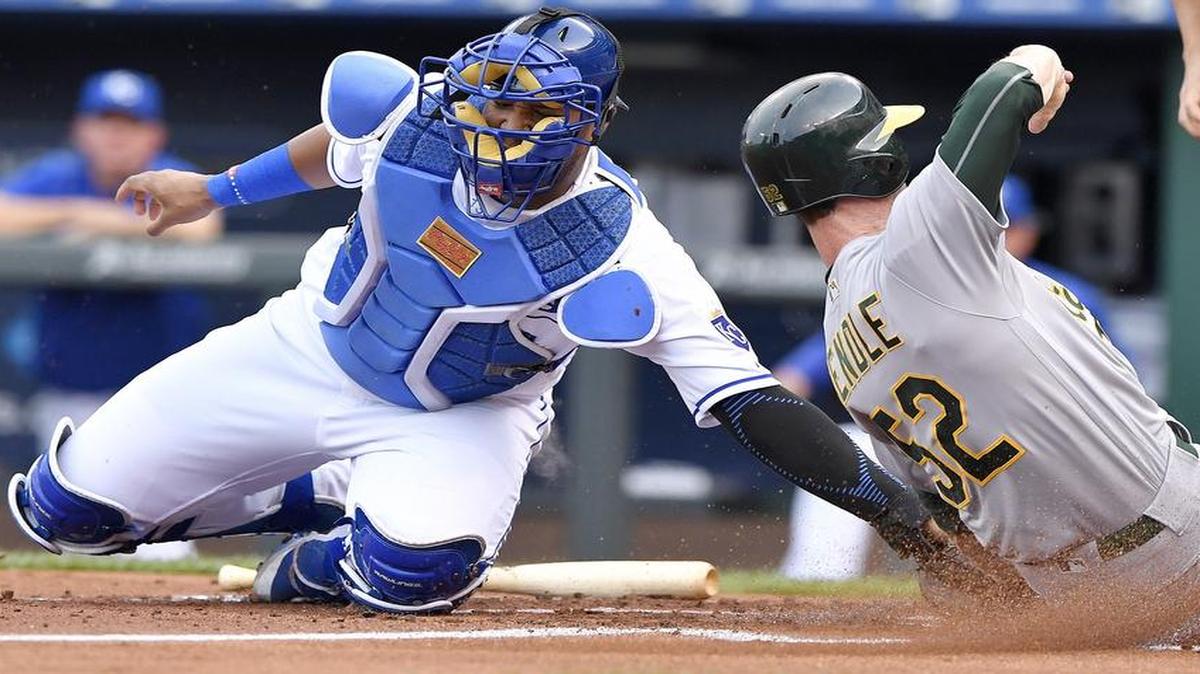 Royals catcher Salvador Perez tagged out the Athletics’ Joey Wendle as he tried to score on a fielder’s choice during the Sept. 14 game at Kauffman Stadium.