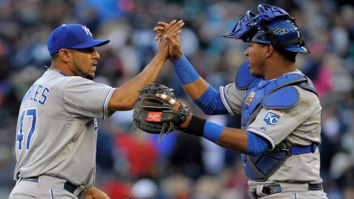 
Royals catcher Salvador Perez (right) congratulates relief pitcher Franklin Morales, left getting the final out against the Twins to end Monday’s baseball game in Minneapolis. The Royals won 12-3.

