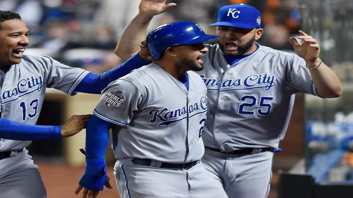 The Royals’ Christian Colon (center) was congratulated by Salvador Perez (left) and Kendrys Morales after Colon drove in the go-ahead run and later scored during their five-run 12th inning.