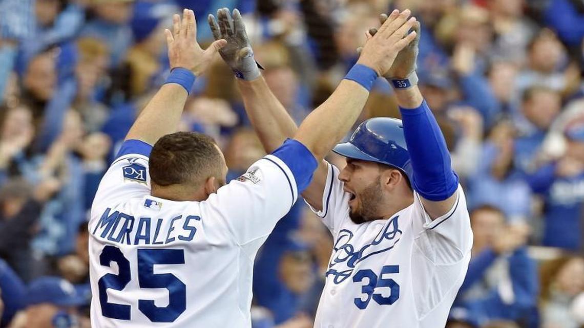 
Kansas City Royals first baseman Eric Hosmer celebrated with designated hitter Kendrys Morales after Hosmer scored on a single by third baseman Mike Moustakas to tie up the game 3-3 during Game 2 of the ALCS on Saturday at Kauffman Stadium in Kansas City, Mo.
