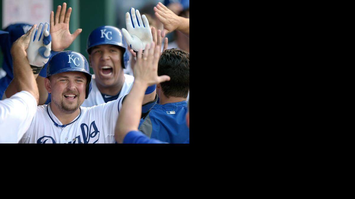
Billy Butler (16) celebrated with his Royals teammates after hitting a two-run home run in the fifth inning against the Cleveland Indians on Saturday night at Kauffman Stadium. The homer proved to be the game-winner as the Royals went on to win 7-5.
