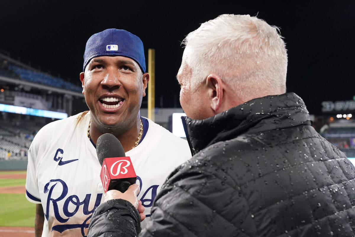 Kansas City Royals catcher Salvador Perez (13) talks with Bally Sports announcer Joel Goldberg after the win over the Houston Astros at Kauffman Stadium on April 9, 2024 in Kansas City.