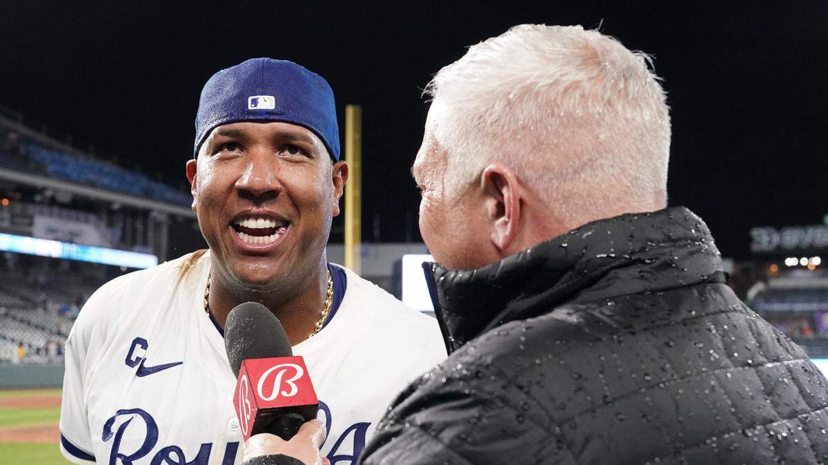 Kansas City Royals catcher Salvador Perez (13) talks with Bally Sports announcer Joel Goldberg after the win over the Houston Astros at Kauffman Stadium on April 9, 2024 in Kansas City.