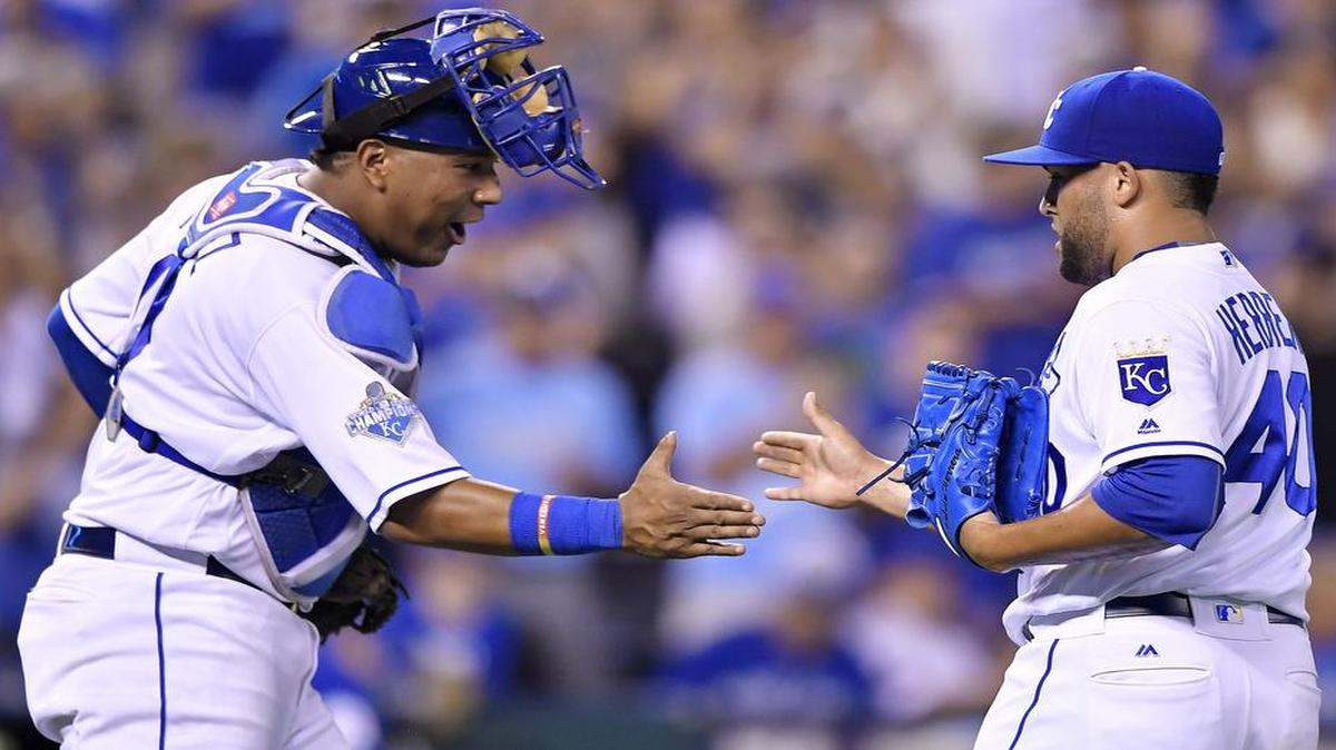Kansas City Royals catcher Salvador Perez and relief pitcher Kelvin Herrera celebrate closing out the ninth inning for a 4-2 win over the Toronto Blue Jays during Saturday's baseball game on August 6, 2016 at Kauffman Stadium in Kansas City, Mo.