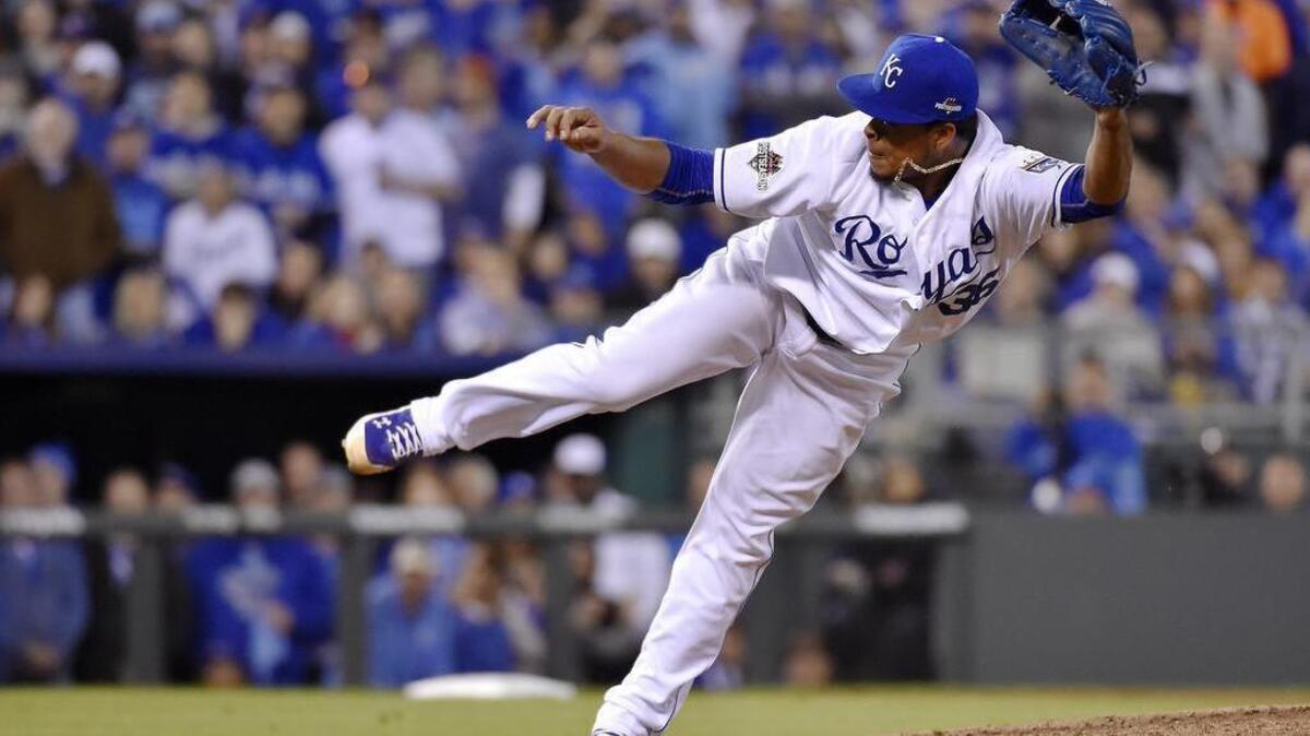 
Kansas City Royals starting pitcher Edinson Volquez follows through on a pitch in the sixth inning during Friday's ALCS baseball game on October 16, 2015 at Kauffman Stadium in Kansas City, Mo.
