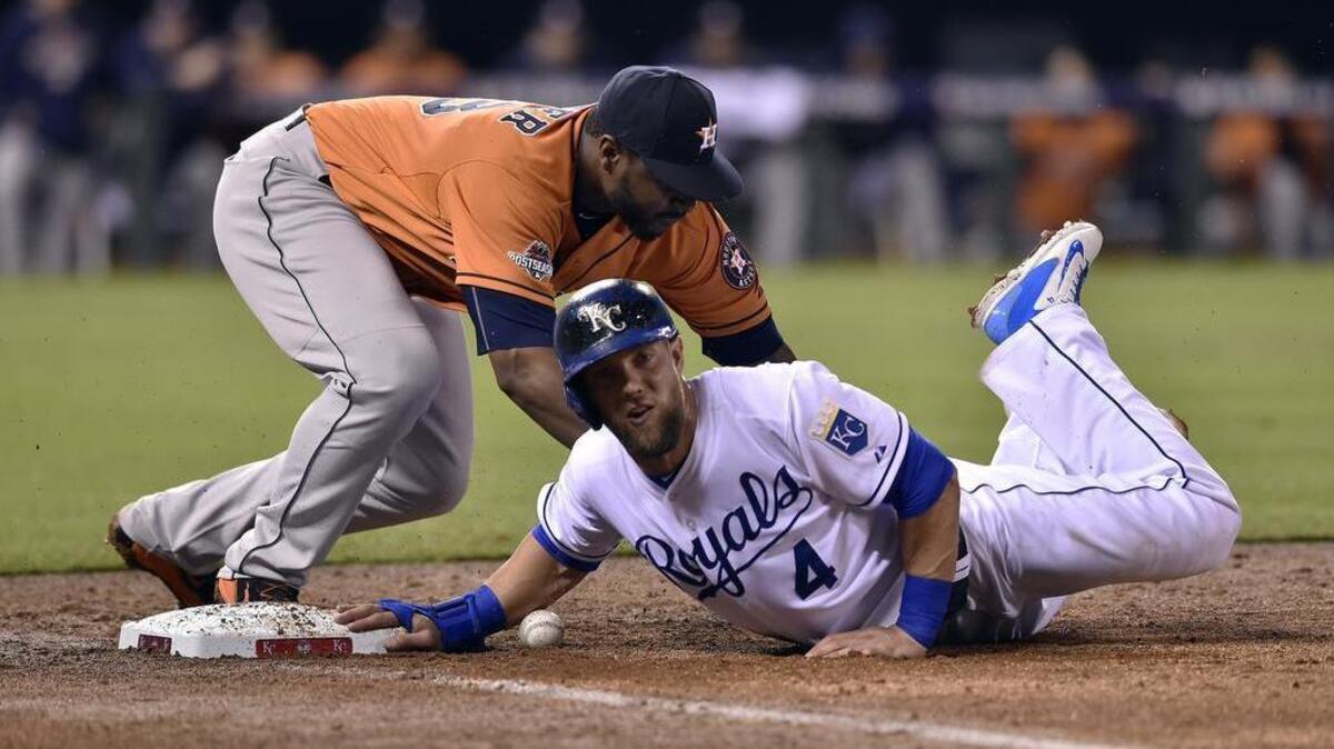 
Kansas City Royals left fielder Alex Gordon avoids a pick off at first from Houston Astros first baseman Chris Carter in the fifth inning during Thursday's ALDS baseball game on October 8, 2015 at Kauffman Stadium in Kansas City, Mo.

