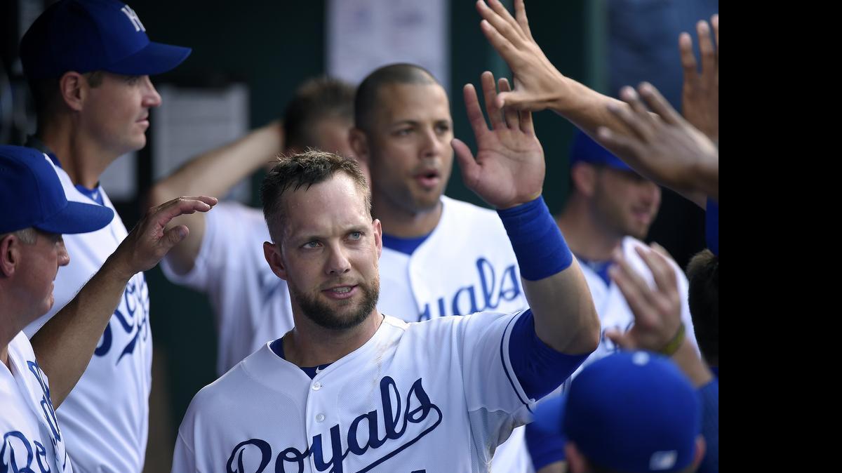 
Kansas City Royals' Alex Gordon (4) is greeted in the dugout after scoring on a single by Alcides Escobar in the second inning during Wednesday's baseball game against the Milwaukee Brewers on June 17, 2015 at Kauffman Stadium in Kansas City, Mo.
