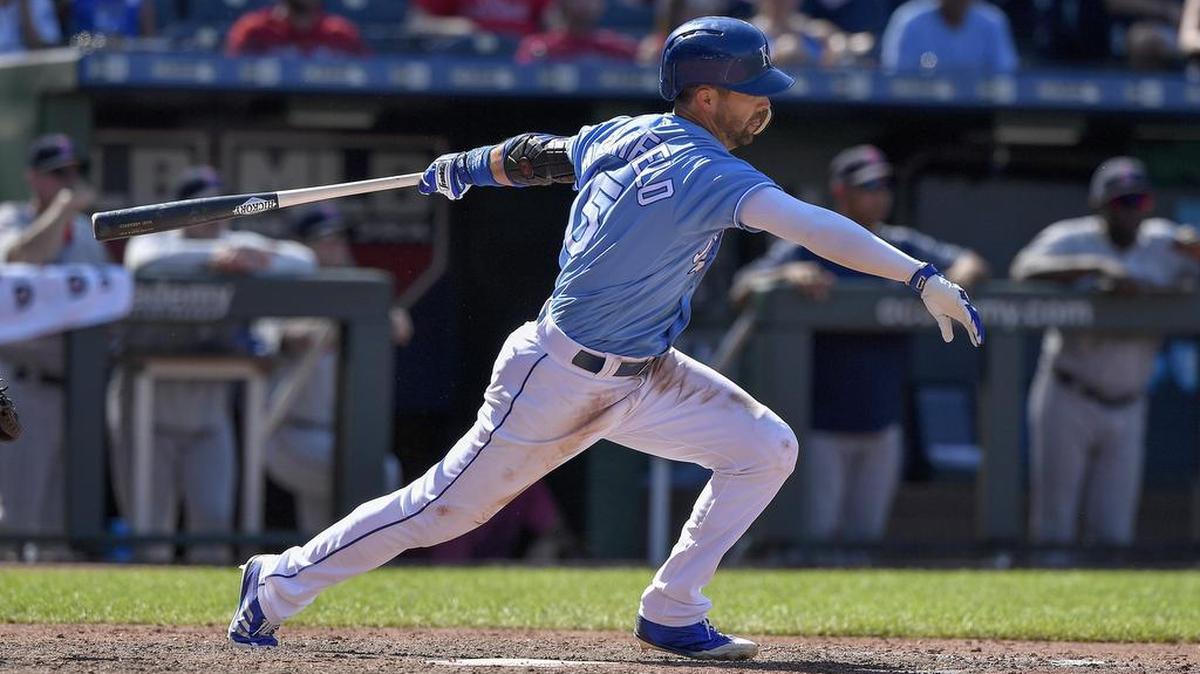 Whit Merrifield follows through on an RBI single to score Adalberto Mondesi in the ninth inning of a July game at Kauffman Stadium.