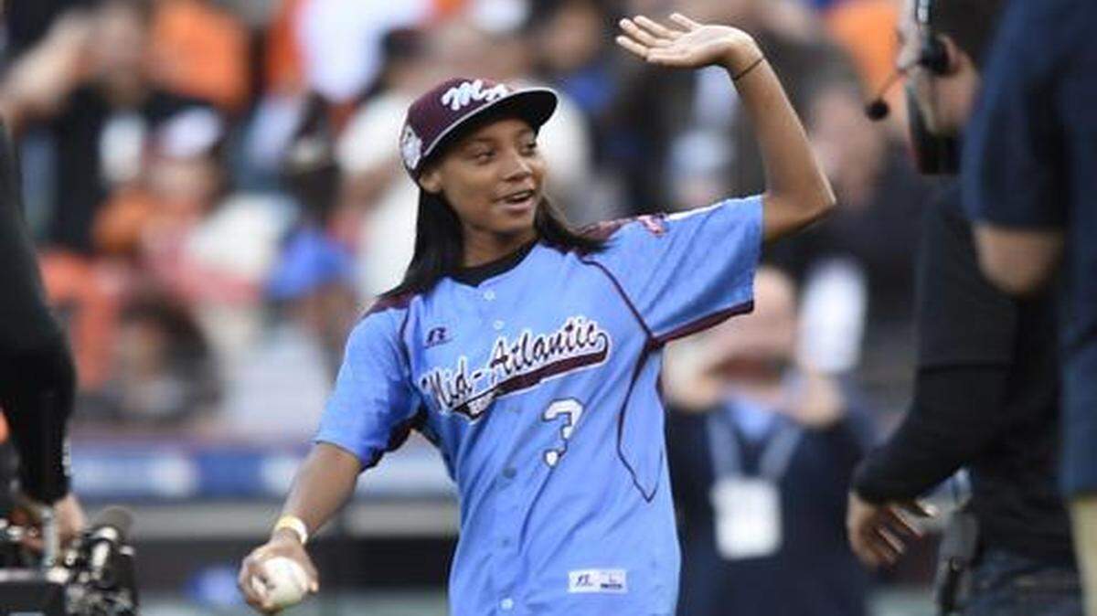
Mo'ne Davis waves to the crowd during opening game ceremonies prior to game four of the World Series on Saturday, October 25, 2014 at AT&T Park in San Francisco, Calif.
