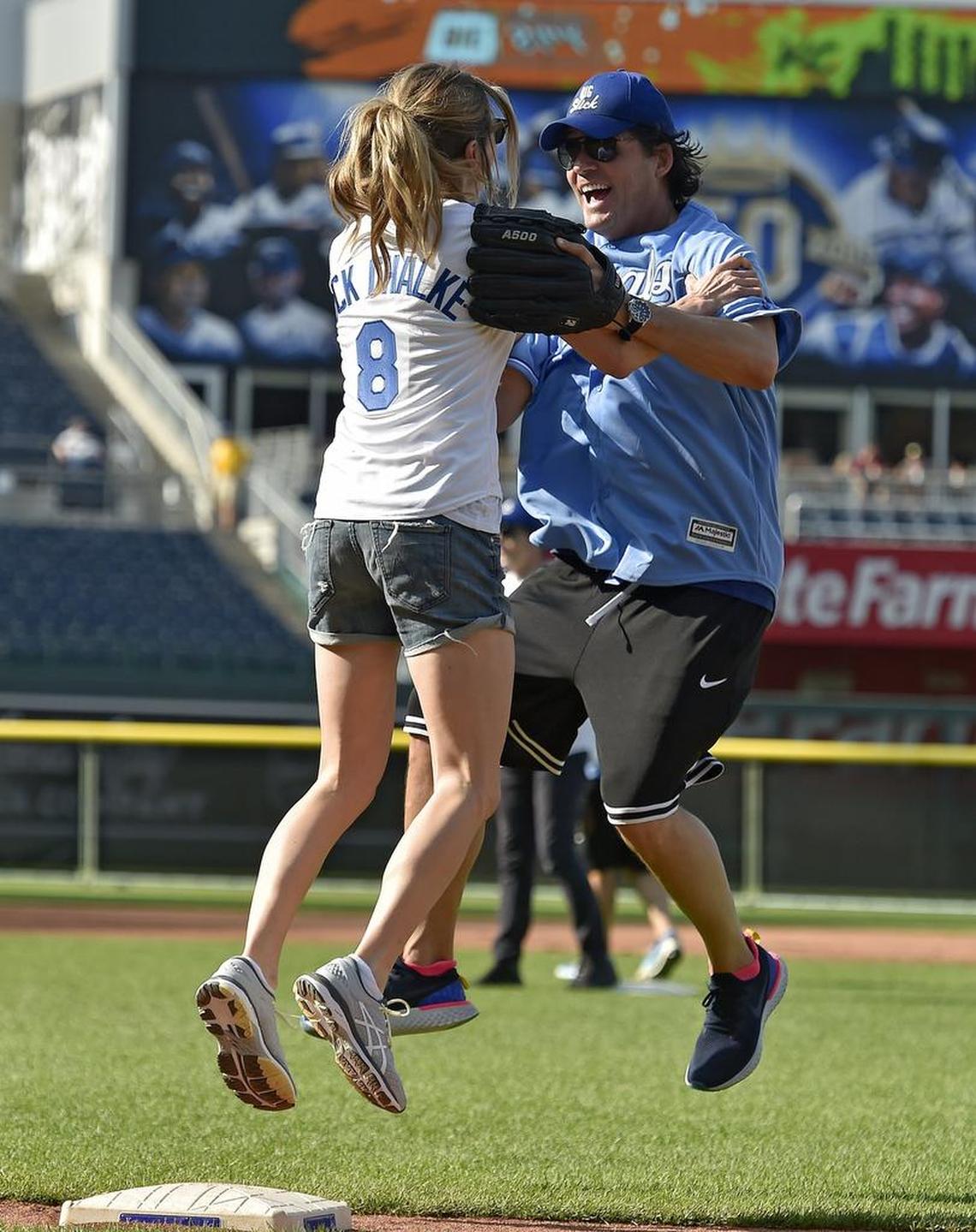 Sarah Chalke of “Roseanne” jumped around with “Cougar Town’s” Josh Hopkins after getting a single at a Big Slick softball game.