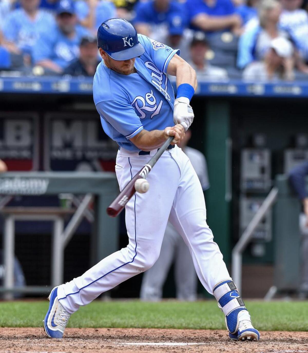 Kansas City Royals' Hunter Dozier connects on a single in the eighth inning during a baseball game against the New York Yankees on May 20, 2018, at Kauffman Stadium in Kansas City, Mo.