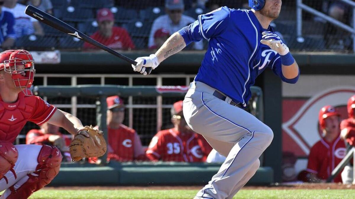 Kansas City Royals' Michael Saunders follows through on a double in the eighth inning during Sunday's spring training baseball game against the Cincinnati Reds on March 4, 2018 in Goodyear, Arizona.