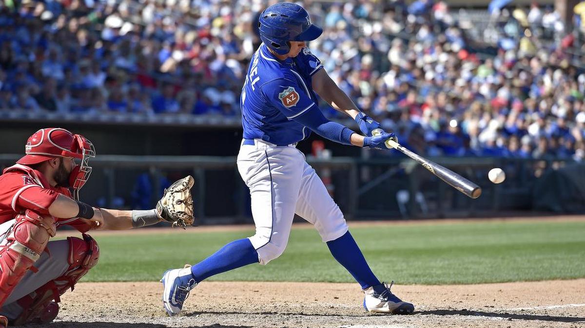 Kansas City Royals' Frank Schwindel connects on a home run in the eighth inning during Friday's spring training baseball game against the Los Angeles Angels on March 18, 2016 in Surprise, Ariz.