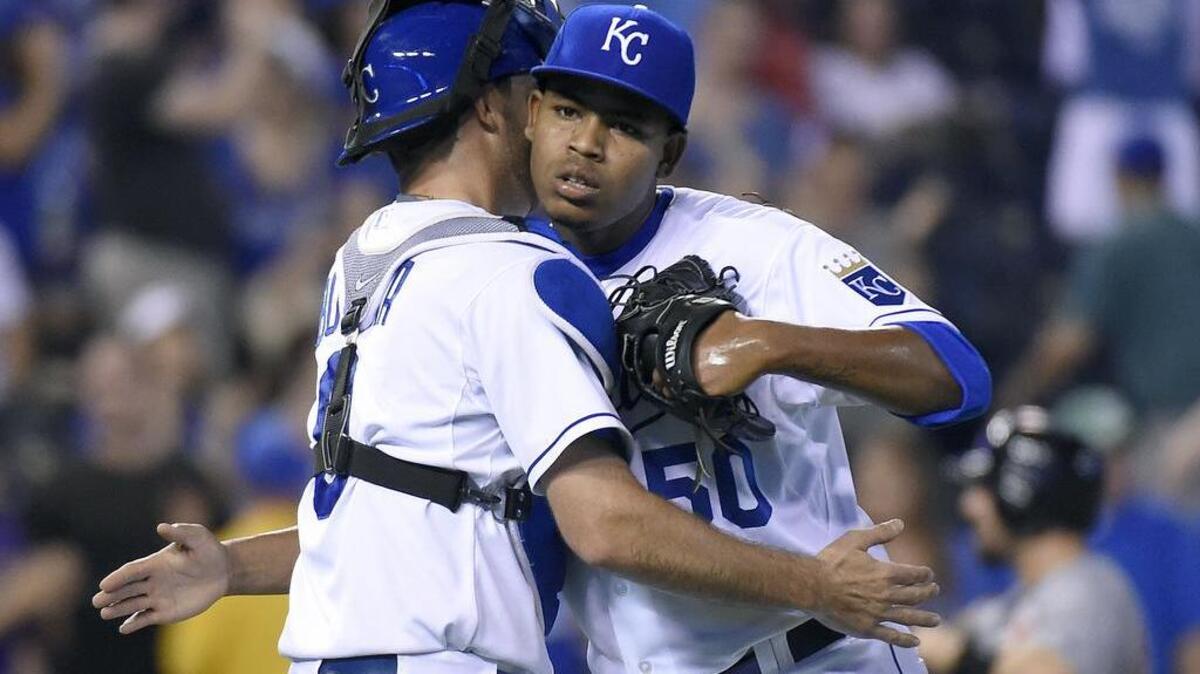 
Kansas City Royals relief pitcher Miguel Almonte (50) and catcher Drew Butera (9) celebrate the teams 15-7 win over the Detroit Tigers during Thursday's baseball game on September 3, 2015 at Kauffman Stadium in Kansas City, Mo.
