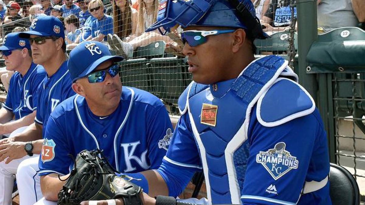 Kansas City Royals catcher Salvador Perez listens to catching coach Pedro Grifol after the top of the first inning during Friday’s spring training baseball game against the Arizona Diamondbacks on March 11, 2016 in Surprise, Ariz.