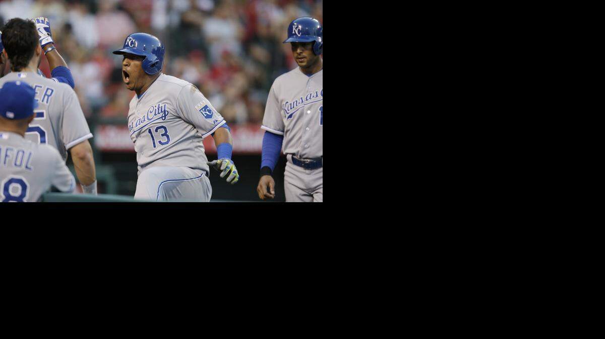 Salvador Perez (center) celebrated his two-run homer during the fourth inning on Saturday against the Angels, in Anaheim, Calif.
