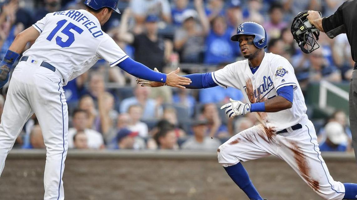 Kansas City Royals’ Rosell Herrera and Whit Merrifield celebrate scoring on a two run single by Lucas Duda in the first inning during Monday’s baseball game against the Detroit Tigers on July 23, 2018 at Kauffman Stadium in Kansas City, Mo.