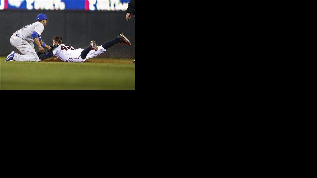 Royals shortstop Alcides Escobar tagged out the Twins' Jordan Schafer in the eighth inning Wednesday in Minneapolis. The Twins won 3-1.