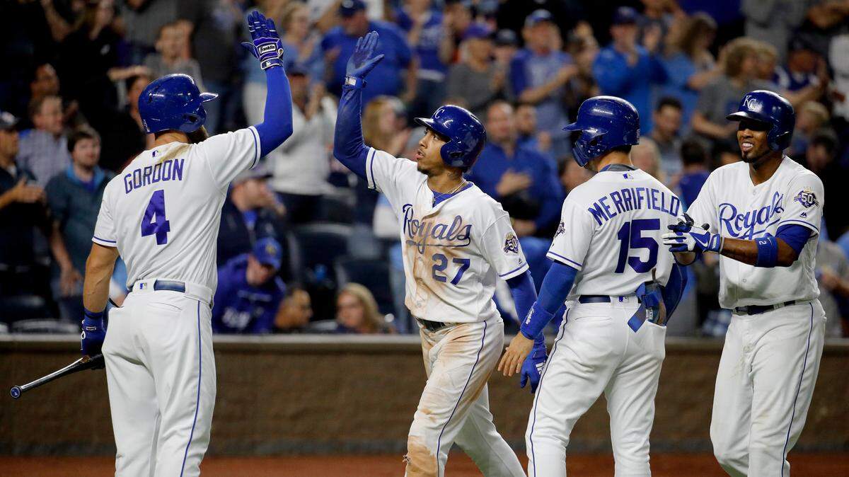 Kansas City Royals’ Adalberto Mondesi (27) celebrates with Alex Gordon (4) after hitting a three-run home run during the sixth inning of a baseball game against the Cleveland Indians on Saturday, Sept. 29, 2018, in Kansas City, Mo. (AP Photo/Charlie Riedel)