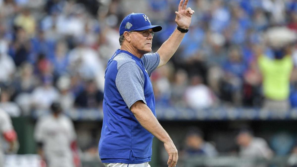 Kansas City Royals manager Ned Yost signals for Kansas City Royals relief pitcher Tim Hill to replace starting pitcher Brad Keller in the fifth inning during Saturday's baseball game against the Boston Red Sox on July 7, 2018, at Kauffman Stadium in Kansas City, Mo.