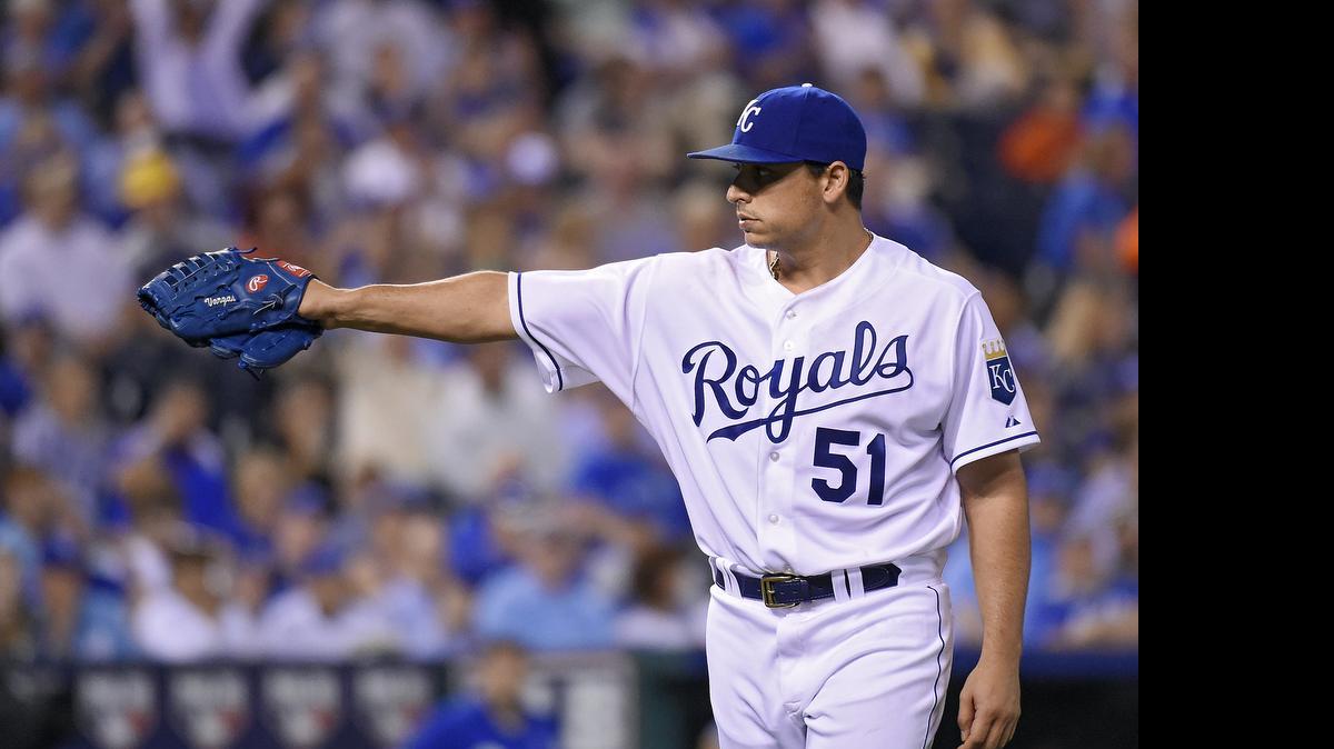 
Kansas City Royals starting pitcher Jason Vargas (51) acknowledges catcher Salvador Perez after finishing up the to of the sixth inning during Tuesday's baseball game against the Cleveland Indians on May 5, 2015 at Kauffman Stadium in Kansas City, Mo.
