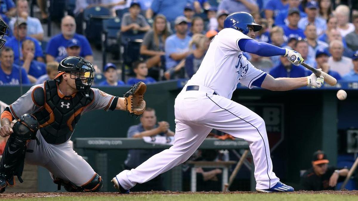 
Kansas City Royals' Mike Moustakas (8) lays down a sacrifice bunt to advance Kendrys Morales to third in the second inning in front of Baltimore Orioles catcher Matt Wieters (32) during Wednesday's baseball game on August 26, 2015 at Kauffman Stadium in Kansas City, Mo.
