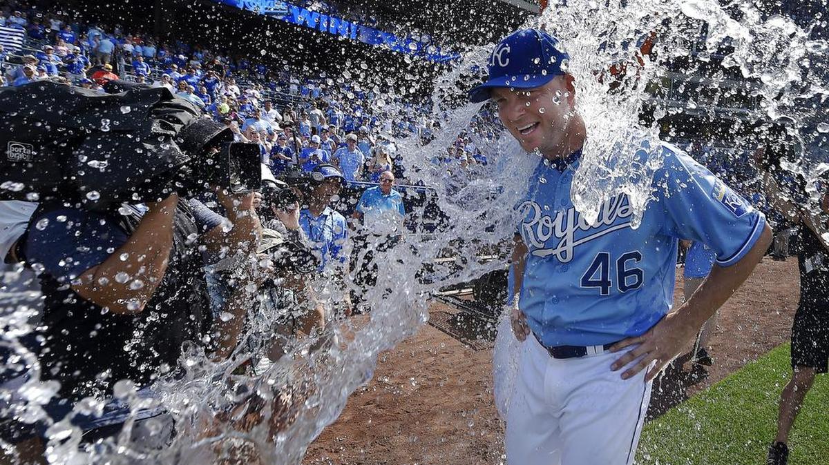 
Kansas City Royals relief pitcher Ryan Madson (46) receives the Salvador Perez drenching after closing out the ninth inning for a 5-4 win over the Chicago White Sox and the three game sweep during Sunday's baseball game on August 9, 2015 at Kauffman Stadium in Kansas City, Mo.
