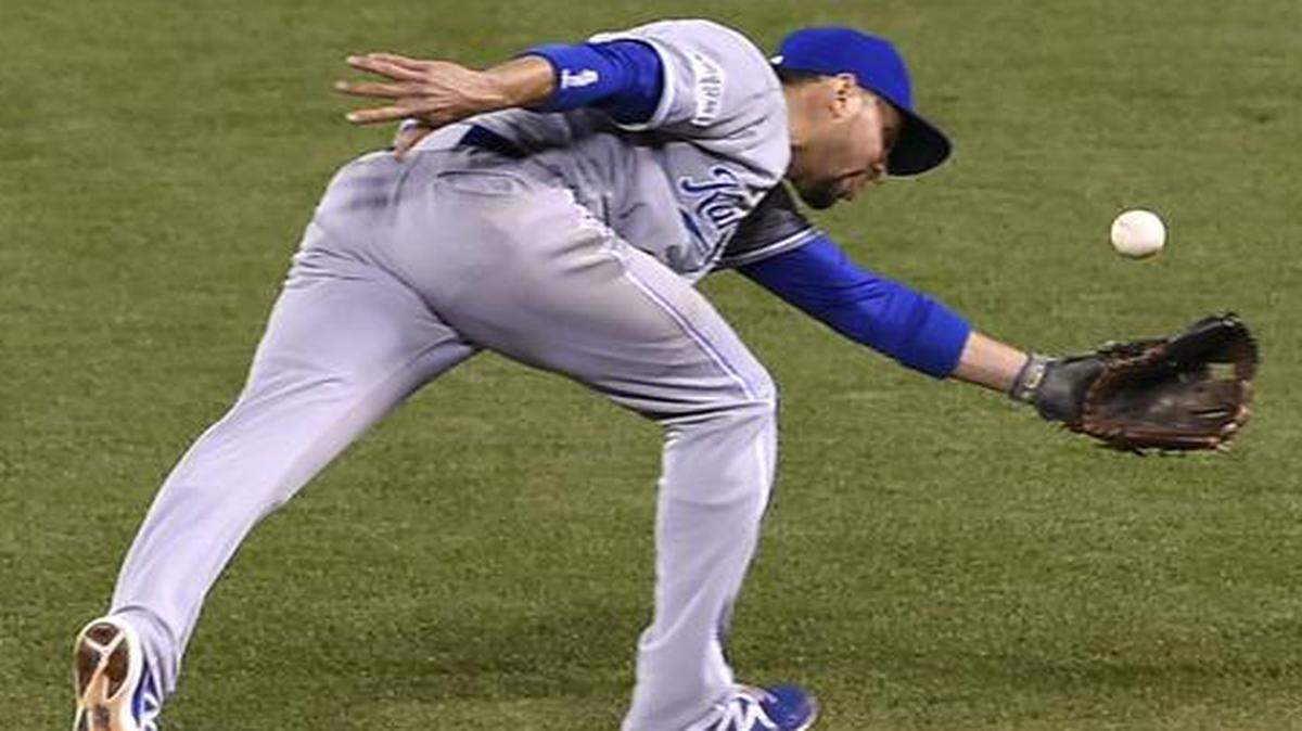 
Kansas City Royals second baseman Omar Infante (14) misses a ball in the sixth inning during Saturday's Kansas City Royals and San Francisco Giants Game 5 of the World Series at AT&T Park on Oct. 26, 2014 in San Francisco, California.

