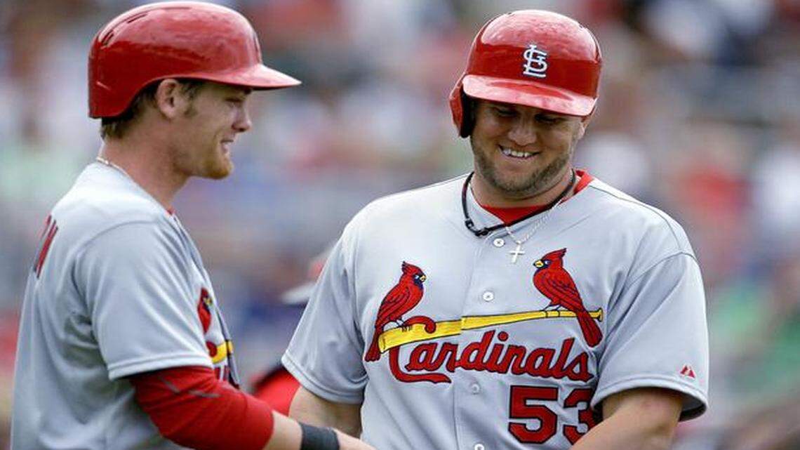 
When he was with the Cardinals organization, Ryan Jackson (left) greeted Matt Adams after they scored in a spring training game in 2013.
