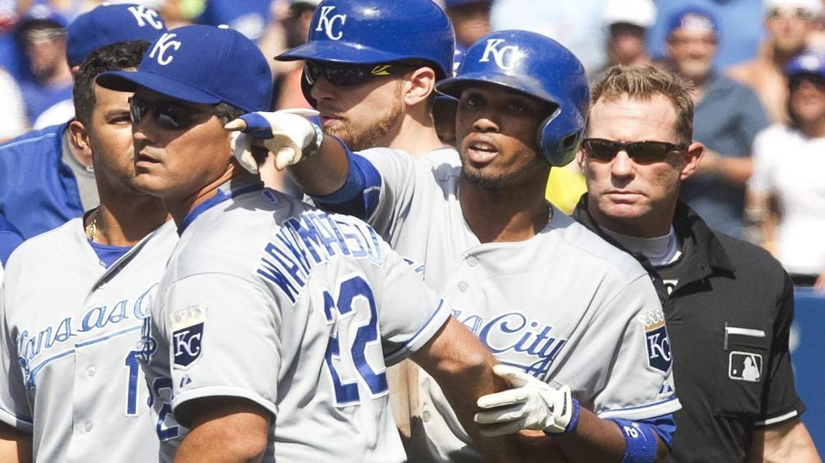 
Kansas City Royals shortstop Alcides Escobar was held back by coach Don Wakamatsu as Escobar gestured at Toronto Blue Jays pitcher Aaron Sanchez who was ejected from their game on Aug. 2.
