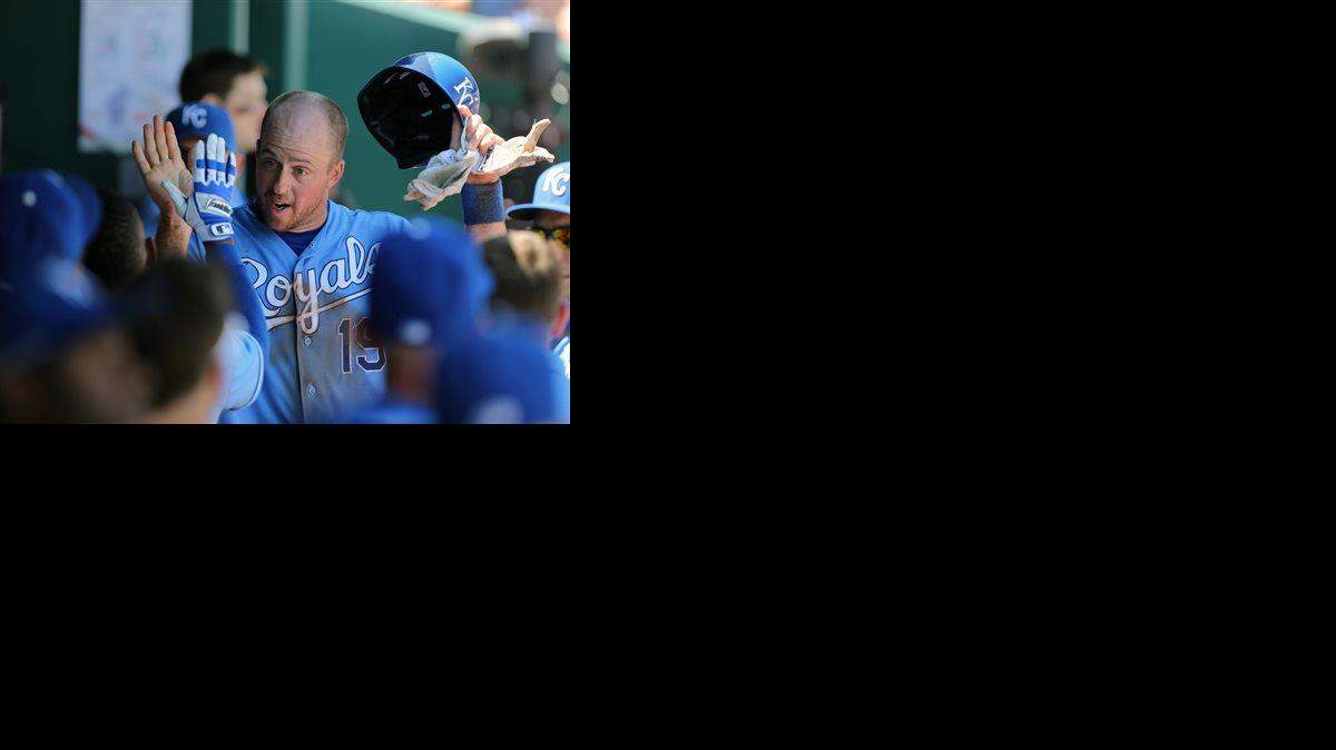 
Kansas City Royals' Erik Kratz (center) is congratulated by teammates after scoring on a Jarrod Dyson sacrifice fly in the third inning Thursday.
