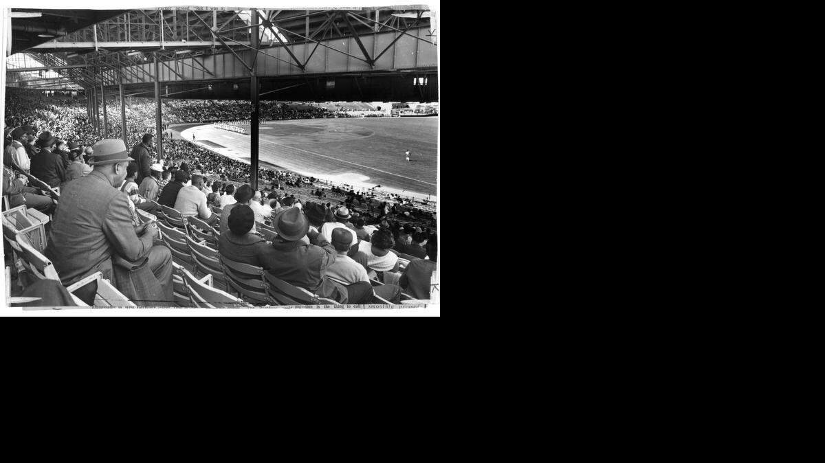 
Many fans of yesteryear didn’t attend baseball games in anything but their Sunday best. Here, nattily attired spectators take in an opening day at old Municipal Stadium.
